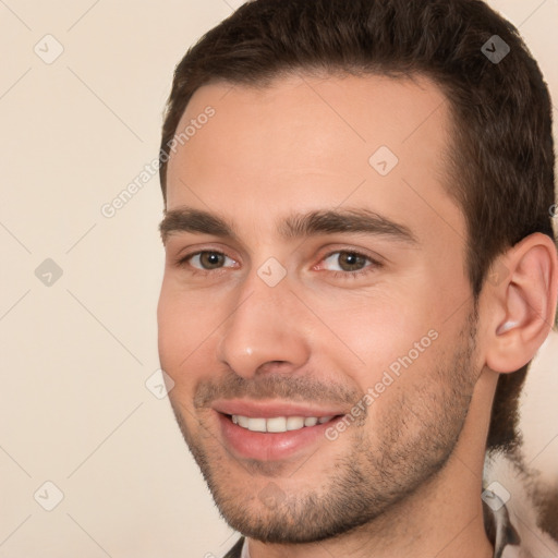 Joyful white young-adult male with short  brown hair and brown eyes