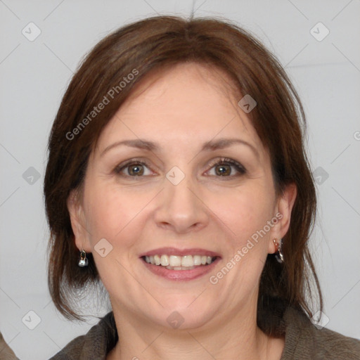 Joyful white adult female with medium  brown hair and grey eyes