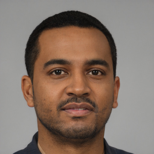 Neutral black young-adult male with short  black hair and brown eyes