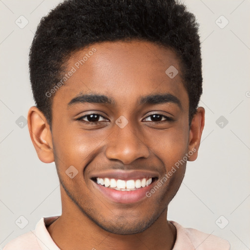 Joyful black young-adult male with short  brown hair and brown eyes