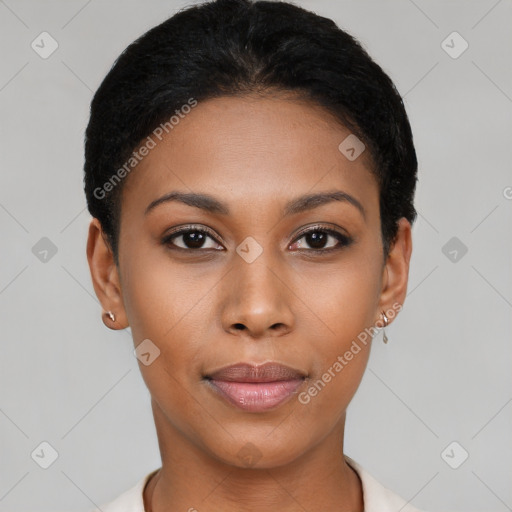 Joyful black young-adult female with short  black hair and brown eyes