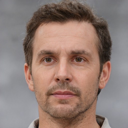 Neutral white adult male with short  brown hair and brown eyes