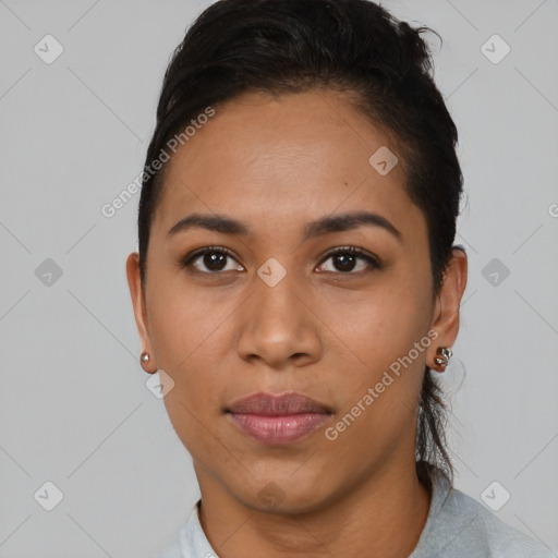 Joyful latino young-adult female with short  brown hair and brown eyes