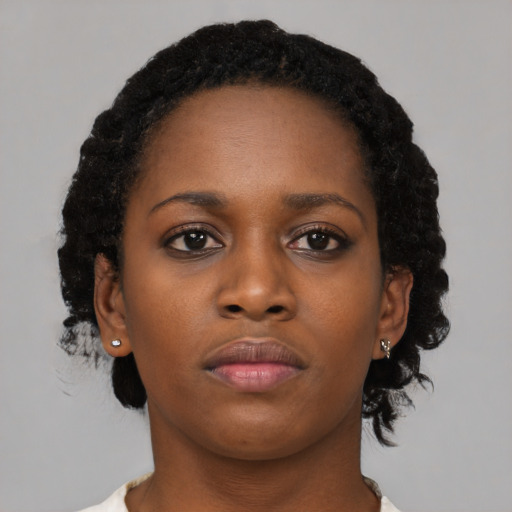 Neutral black young-adult female with medium  black hair and brown eyes