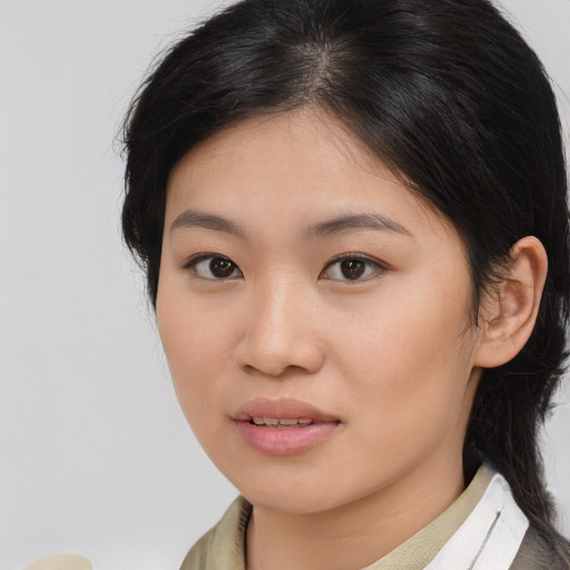 Joyful asian young-adult female with medium  brown hair and brown eyes