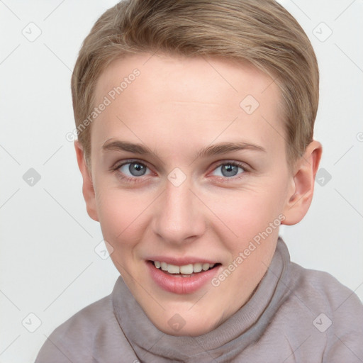 Joyful white young-adult female with short  brown hair and grey eyes