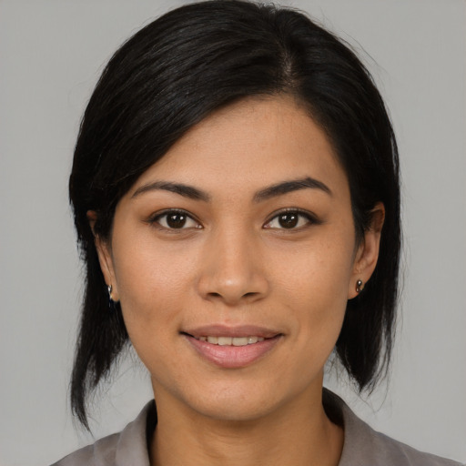 Joyful asian young-adult female with medium  black hair and brown eyes