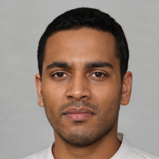 Neutral latino young-adult male with short  black hair and brown eyes