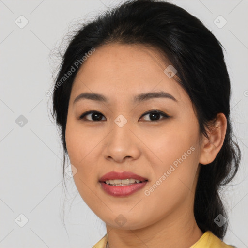 Joyful asian young-adult female with medium  brown hair and brown eyes