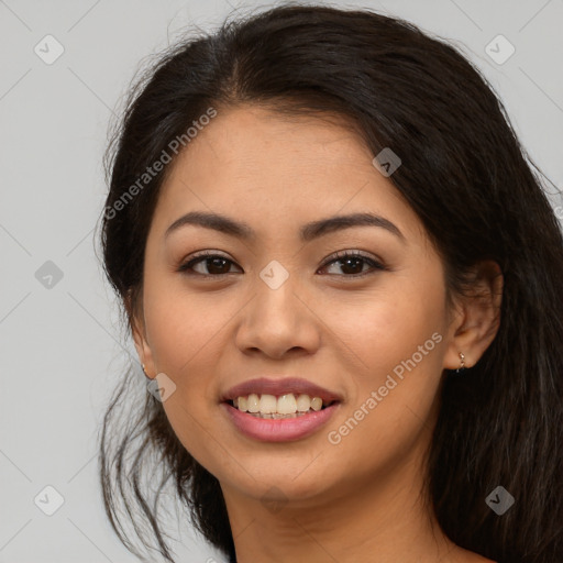 Joyful white young-adult female with long  brown hair and brown eyes