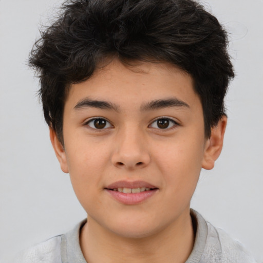 Joyful asian child male with short  brown hair and brown eyes