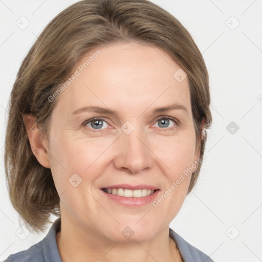 Joyful white adult female with medium  brown hair and grey eyes