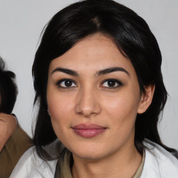 Joyful asian young-adult female with medium  black hair and brown eyes