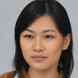 Neutral asian young-adult female with medium  brown hair and brown eyes