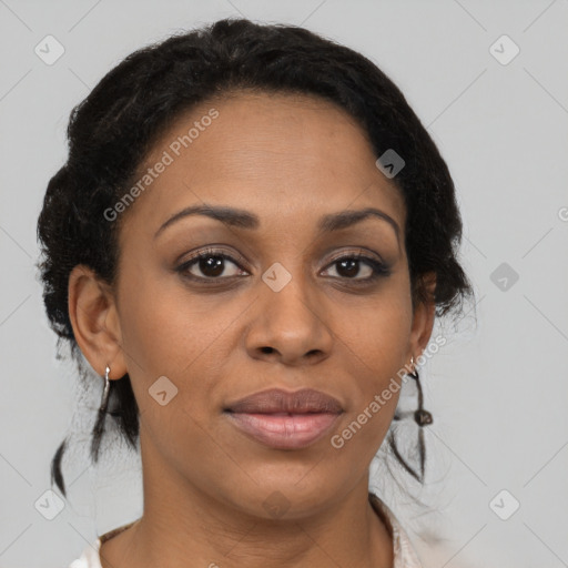 Joyful black adult female with medium  brown hair and brown eyes