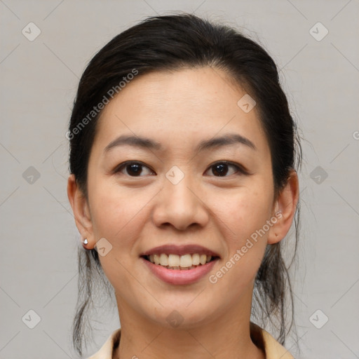 Joyful asian young-adult female with medium  brown hair and brown eyes