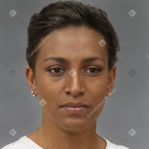 Joyful black young-adult female with short  brown hair and brown eyes