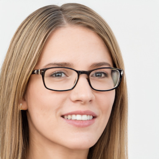 Joyful white young-adult female with long  brown hair and blue eyes