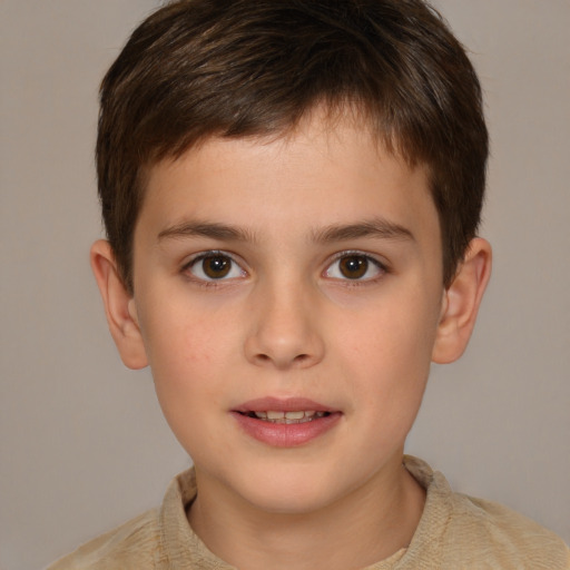 Joyful white child male with short  brown hair and brown eyes