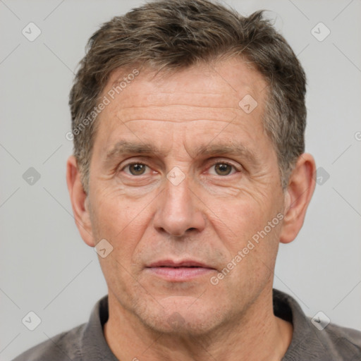 Joyful white middle-aged male with short  brown hair and brown eyes