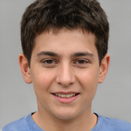 Joyful white child male with short  brown hair and brown eyes