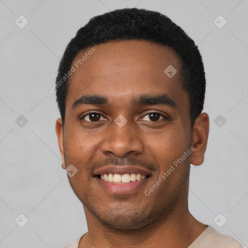 Joyful black young-adult male with short  black hair and brown eyes