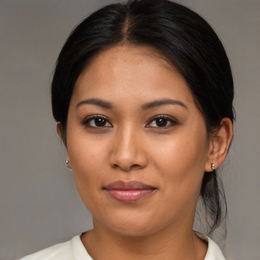 Joyful asian young-adult female with medium  brown hair and brown eyes