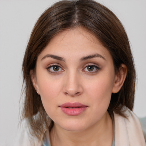 Neutral white young-adult female with medium  brown hair and brown eyes