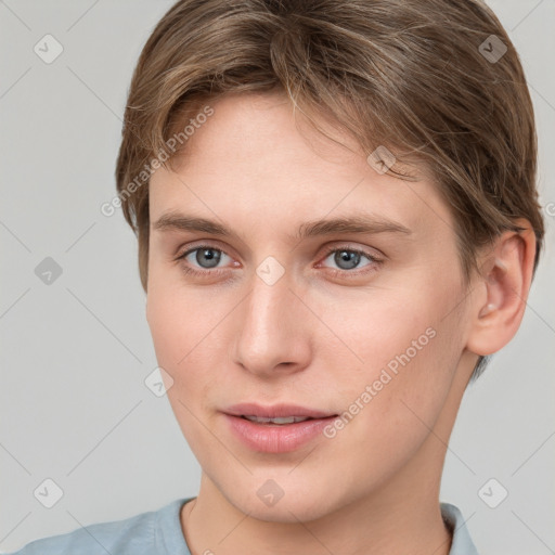 Joyful white young-adult female with short  brown hair and grey eyes