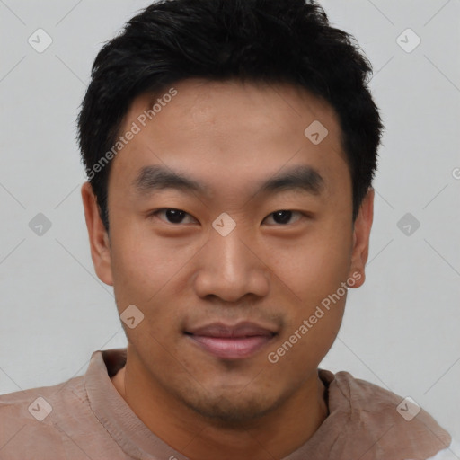 Joyful asian young-adult male with short  black hair and brown eyes