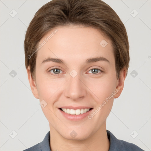 Joyful white young-adult female with short  brown hair and grey eyes