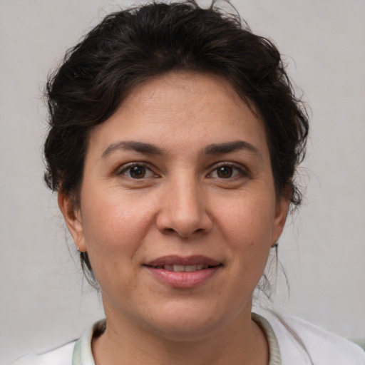Joyful white adult female with short  brown hair and brown eyes