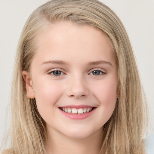 Joyful white child female with long  brown hair and brown eyes