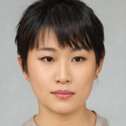 Neutral asian young-adult female with medium  brown hair and brown eyes