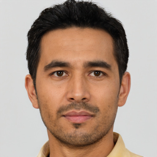 Neutral latino young-adult male with short  black hair and brown eyes