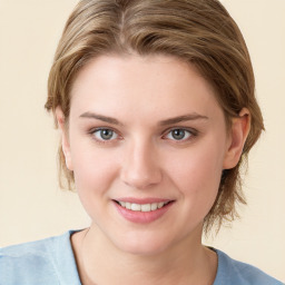 Joyful white young-adult female with medium  brown hair and blue eyes