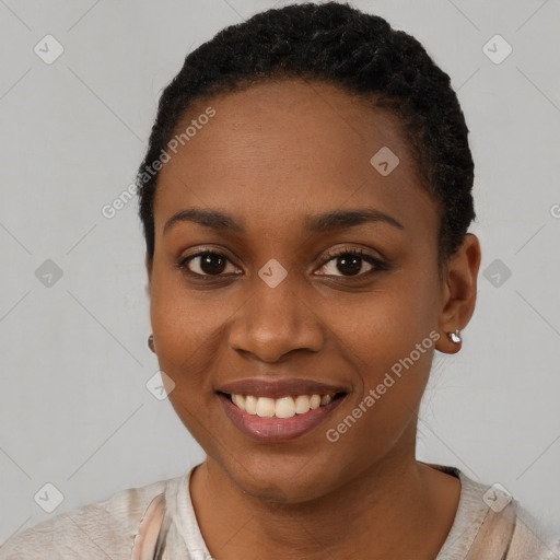 Joyful black young-adult female with short  brown hair and brown eyes