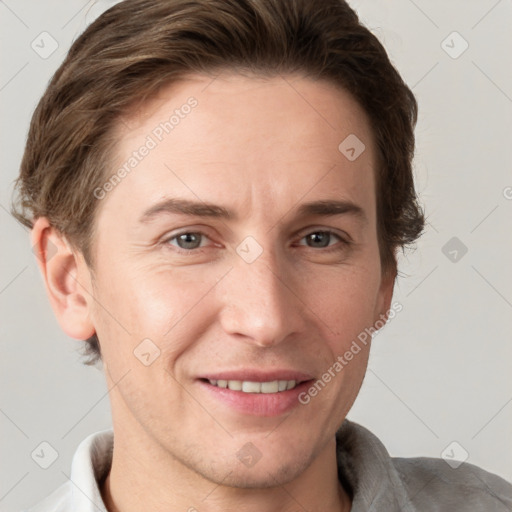 Joyful white adult male with short  brown hair and grey eyes