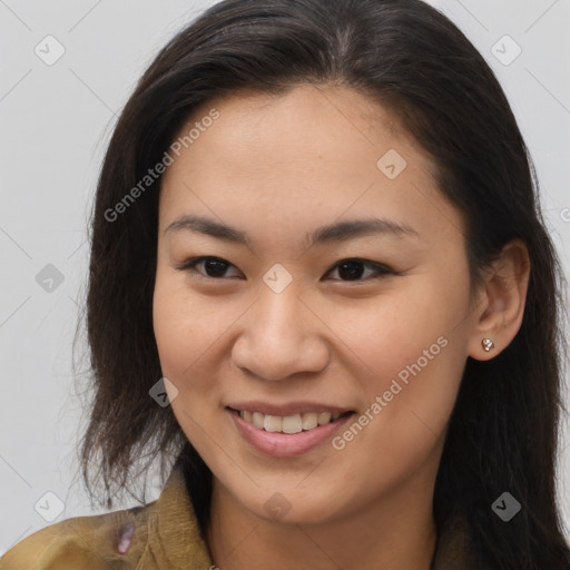 Joyful asian young-adult female with long  brown hair and brown eyes