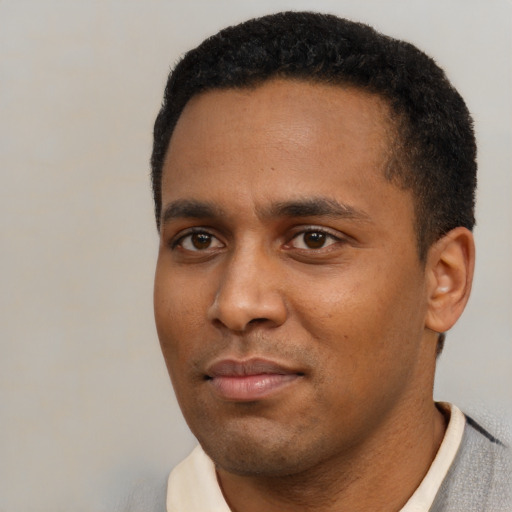 Neutral black young-adult male with short  black hair and brown eyes