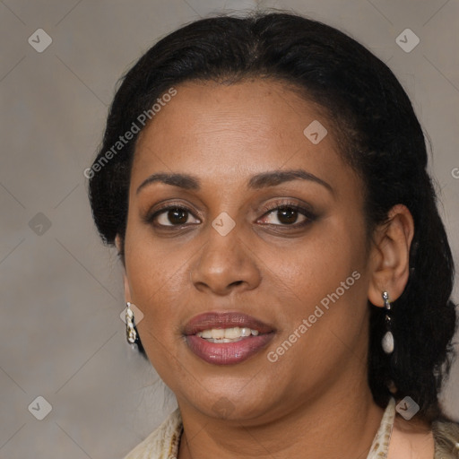 Joyful black adult female with medium  brown hair and brown eyes