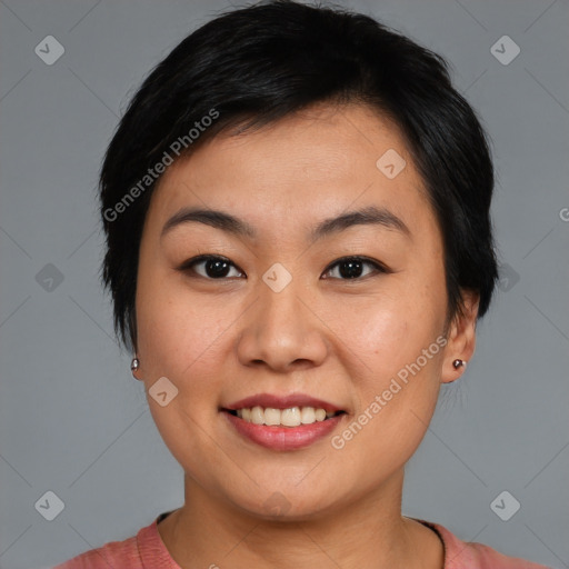 Joyful asian young-adult female with medium  black hair and brown eyes