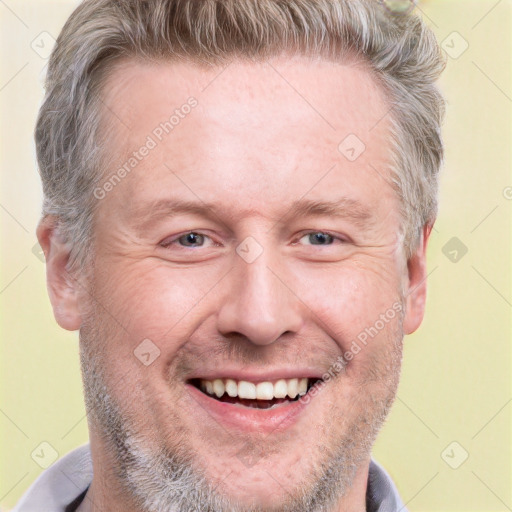 Joyful white adult male with short  brown hair and grey eyes