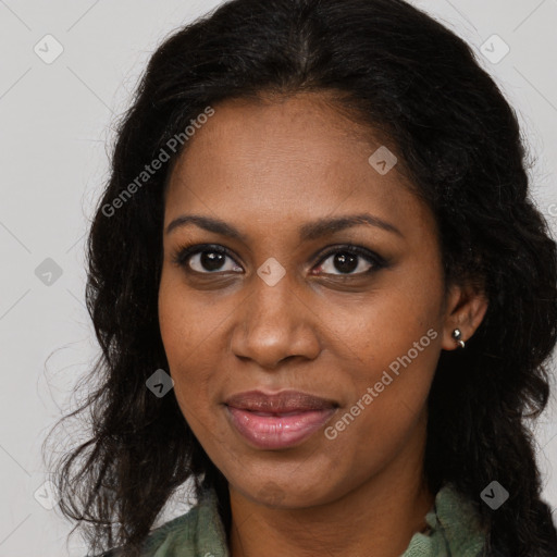 Joyful black young-adult female with long  brown hair and brown eyes