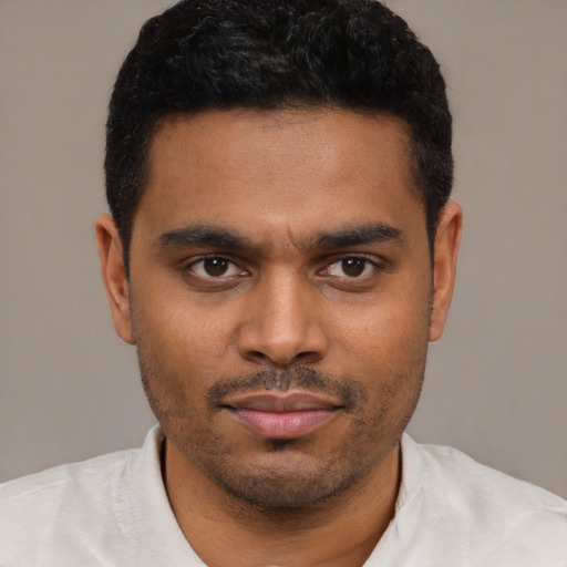 Neutral latino young-adult male with short  black hair and brown eyes