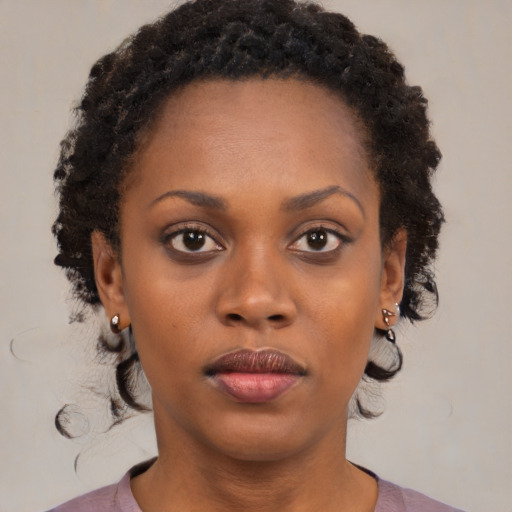 Neutral black young-adult female with short  brown hair and brown eyes