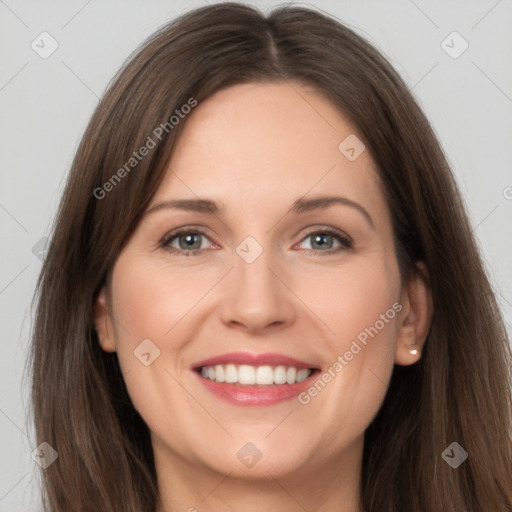 Joyful white young-adult female with long  brown hair and grey eyes