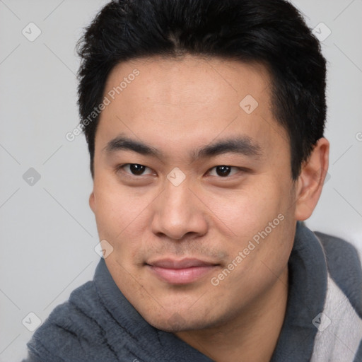 Joyful white young-adult male with short  black hair and brown eyes