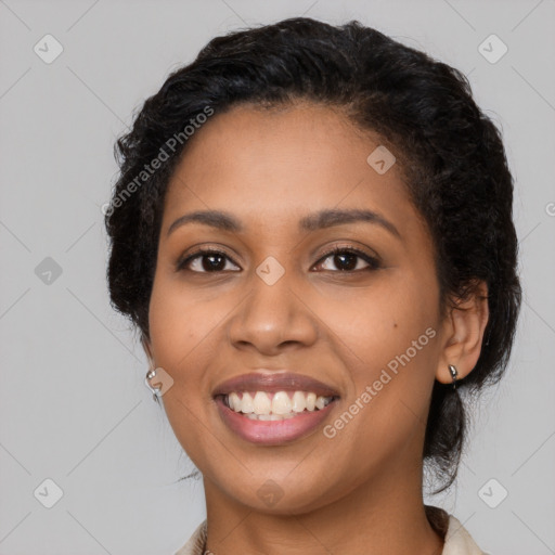 Joyful latino young-adult female with long  black hair and brown eyes