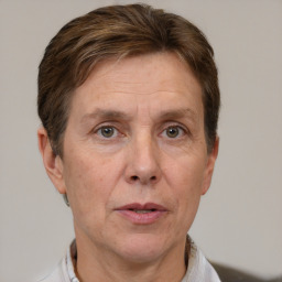 Joyful white adult male with short  brown hair and grey eyes